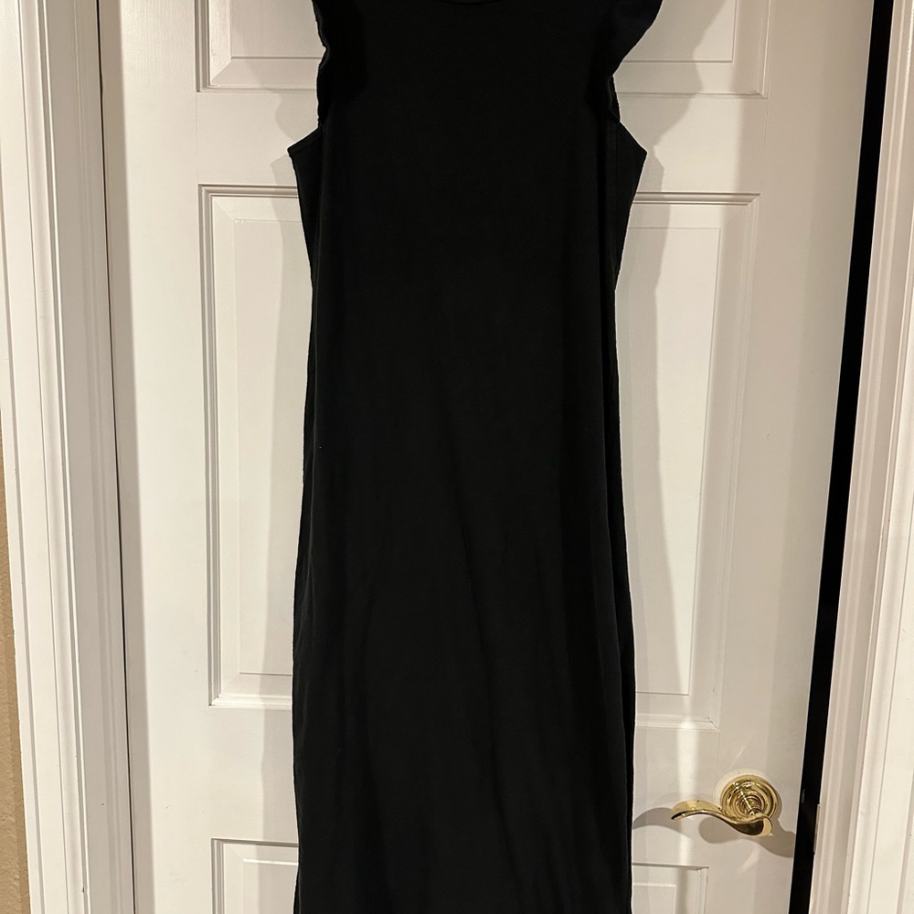 Cute cotton midi dress with ruffle cap sleeves and slit sides.